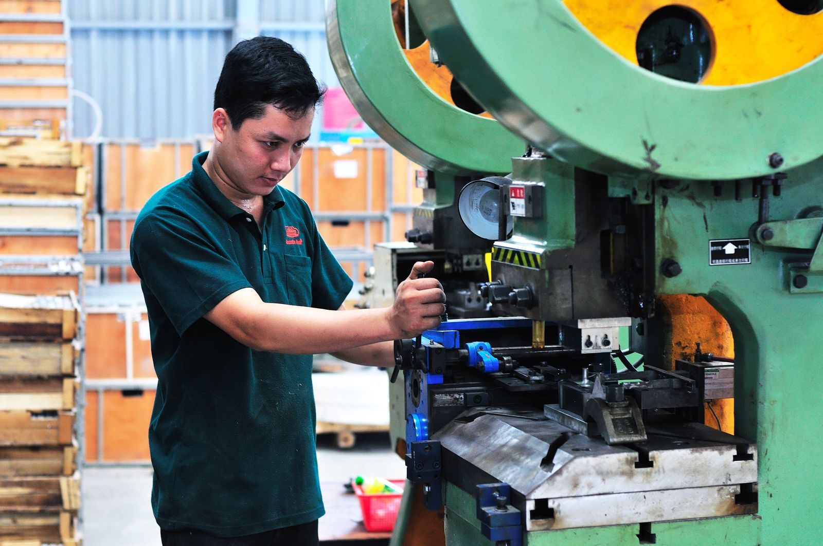 Plastic injection moulding machine with its mould tool installed.