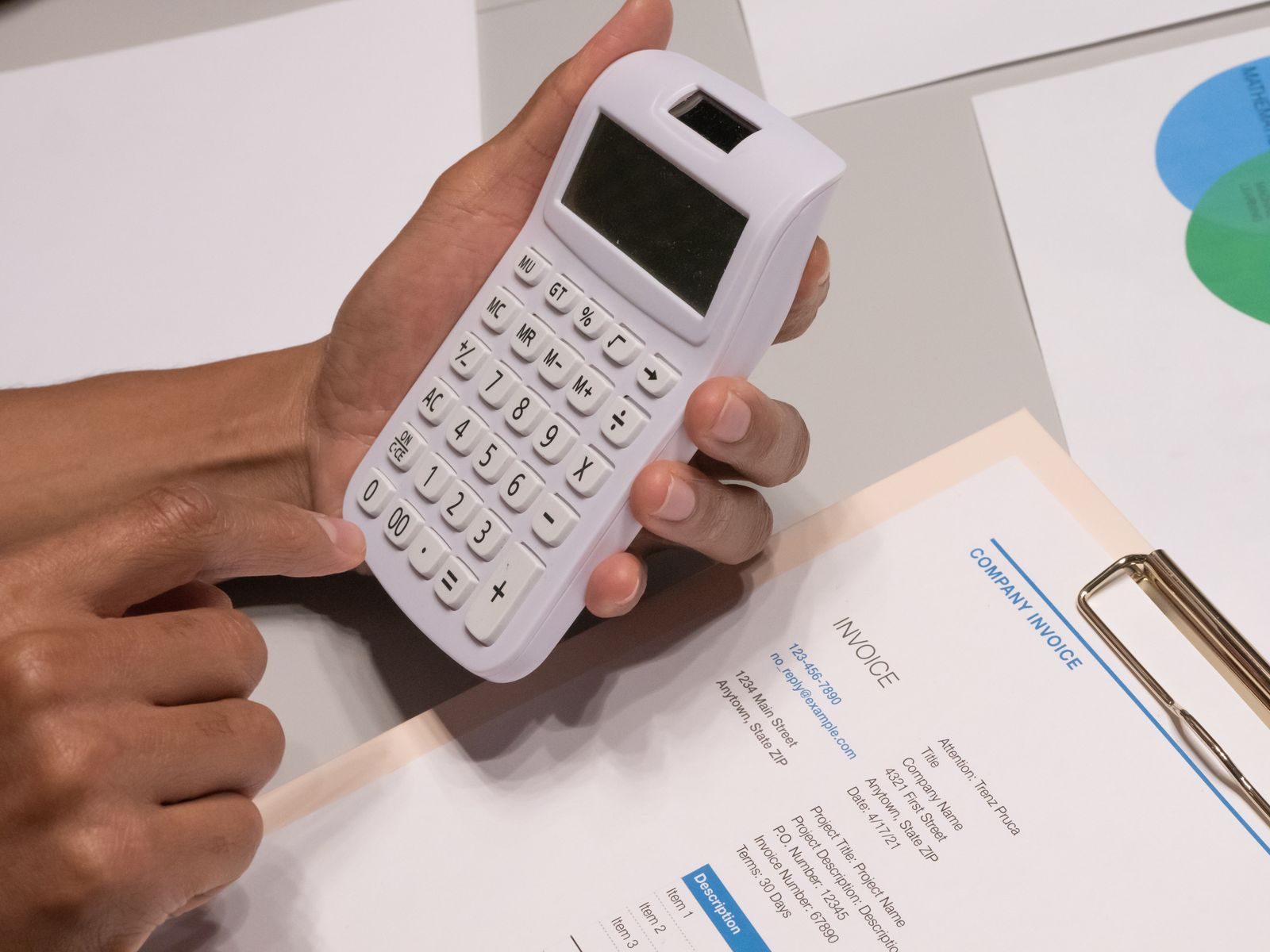 Engineering quotation and cost estimate paperwork on a desk.
