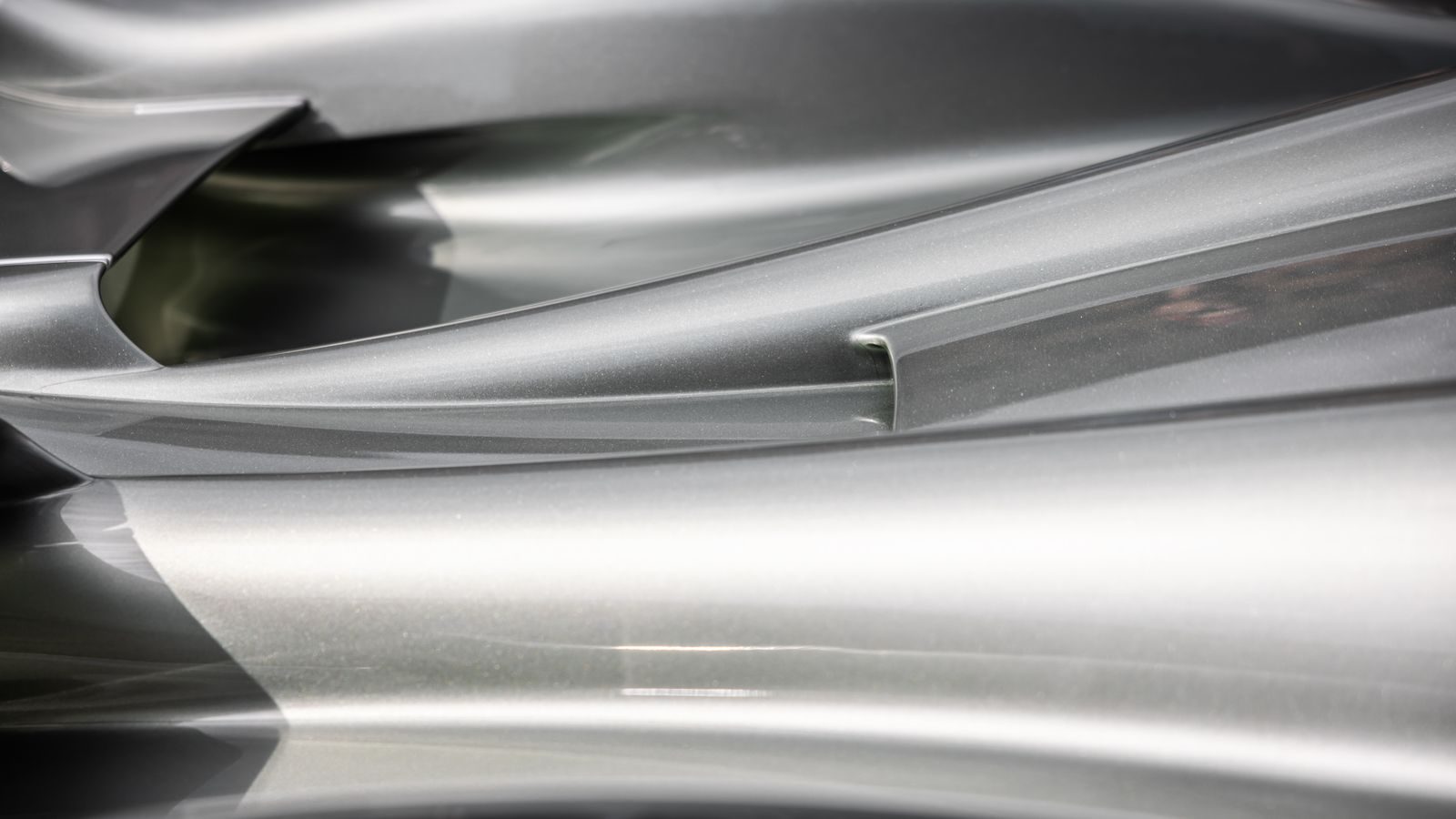 Close-up of a turned metal surface showing fine concentric machining marks.